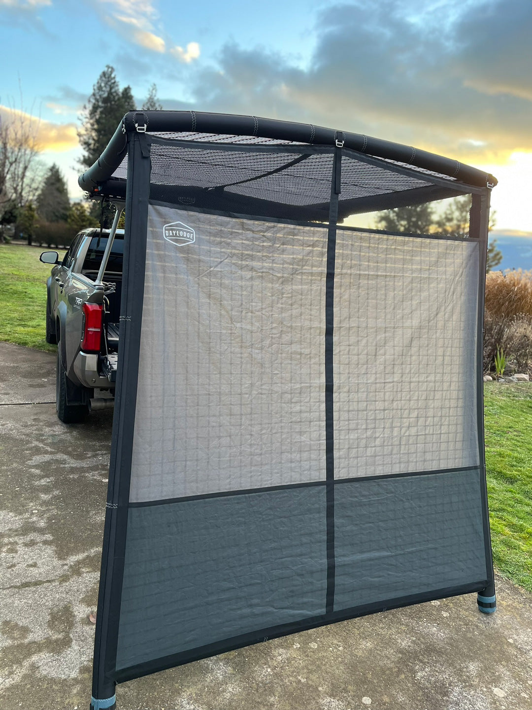 Installed view of the DAYLODGE AirHaven 40 Annex Wall Kit, part of a vehicle based camp and travel setup