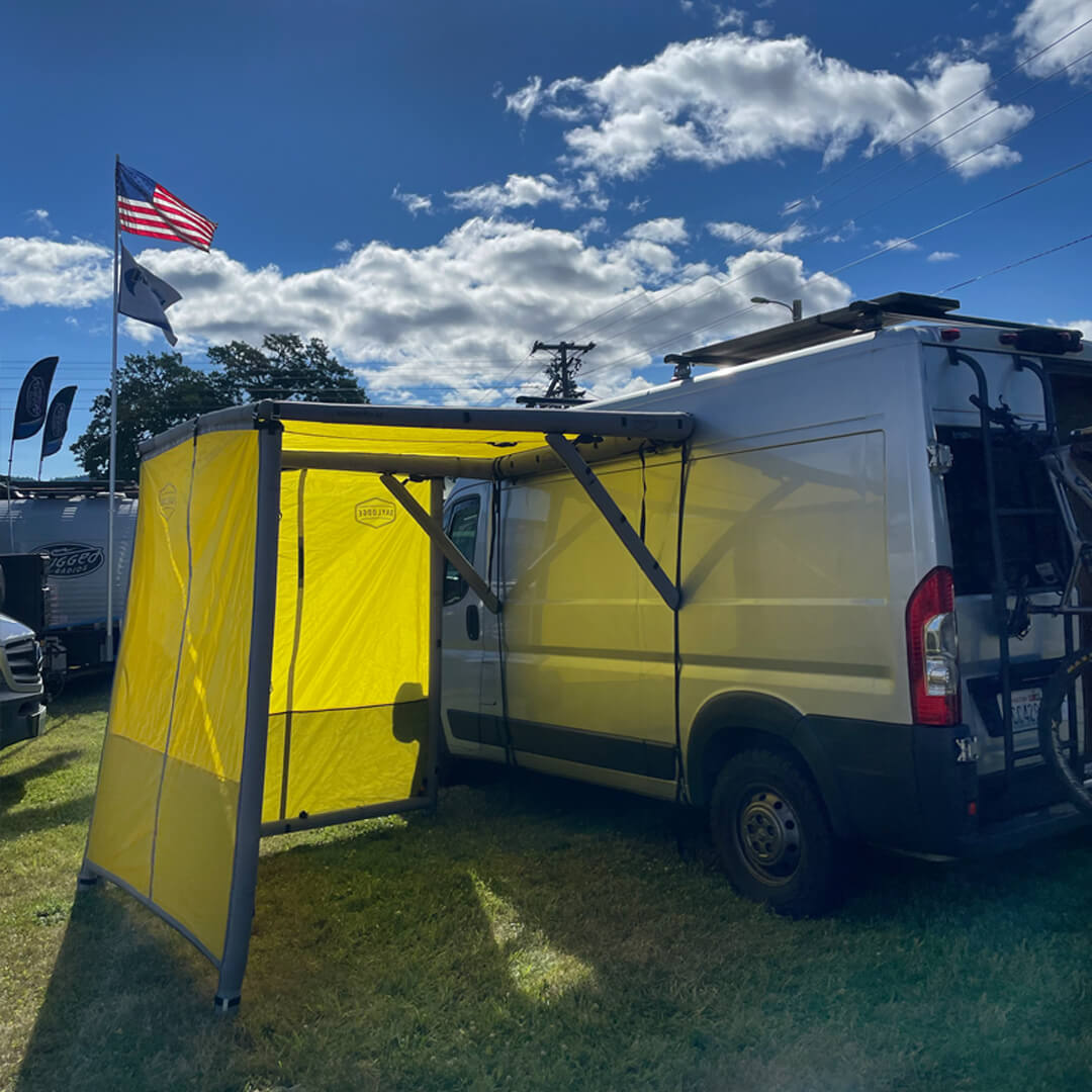 Supporting view of the DAYLODGE AirHaven 40 Annex Wall Kit, part of a vehicle based camp and travel setup