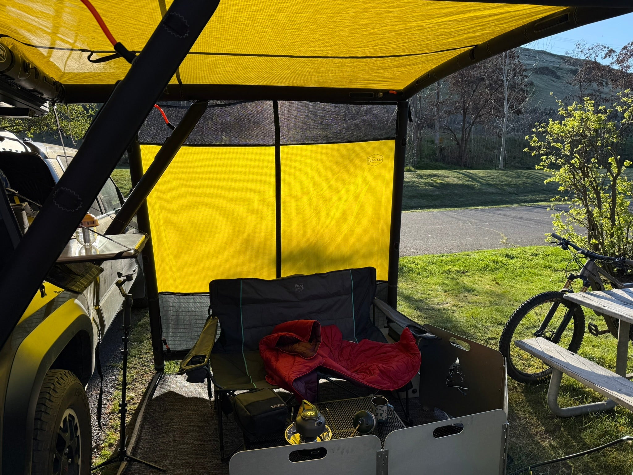 DAYLODGE AirHaven 40 annex wall kit seen from inside in bronze, enclosing the side of the shelter