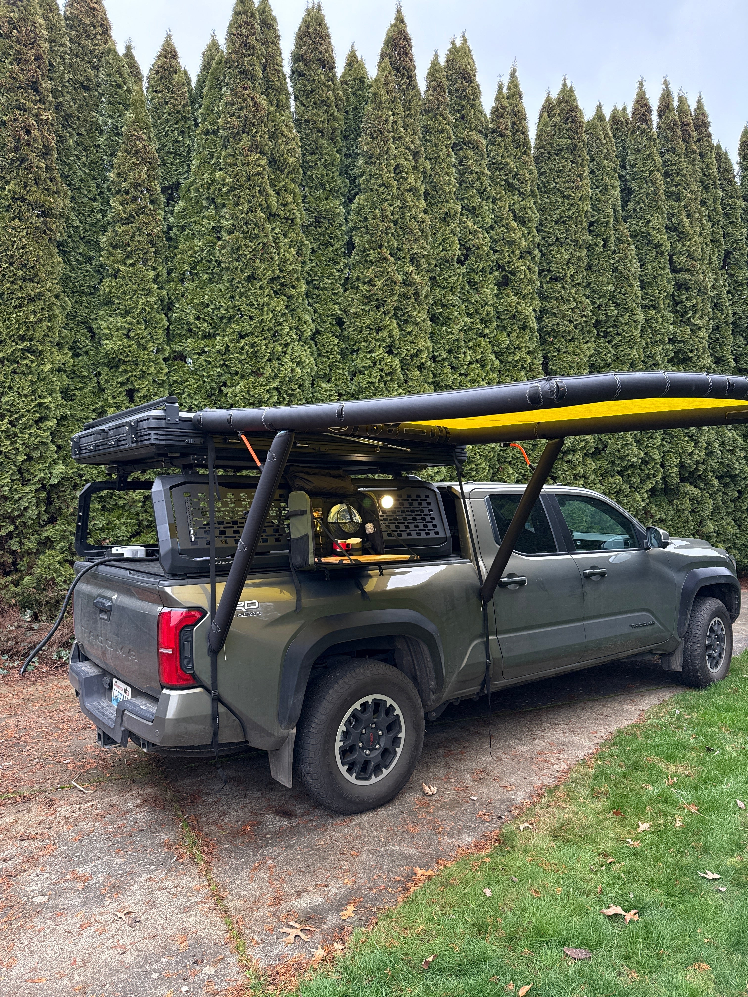 Companion view of the DAYLODGE AirHaven 40 Vehicle Shelter System, part of a vehicle based camp and travel setup