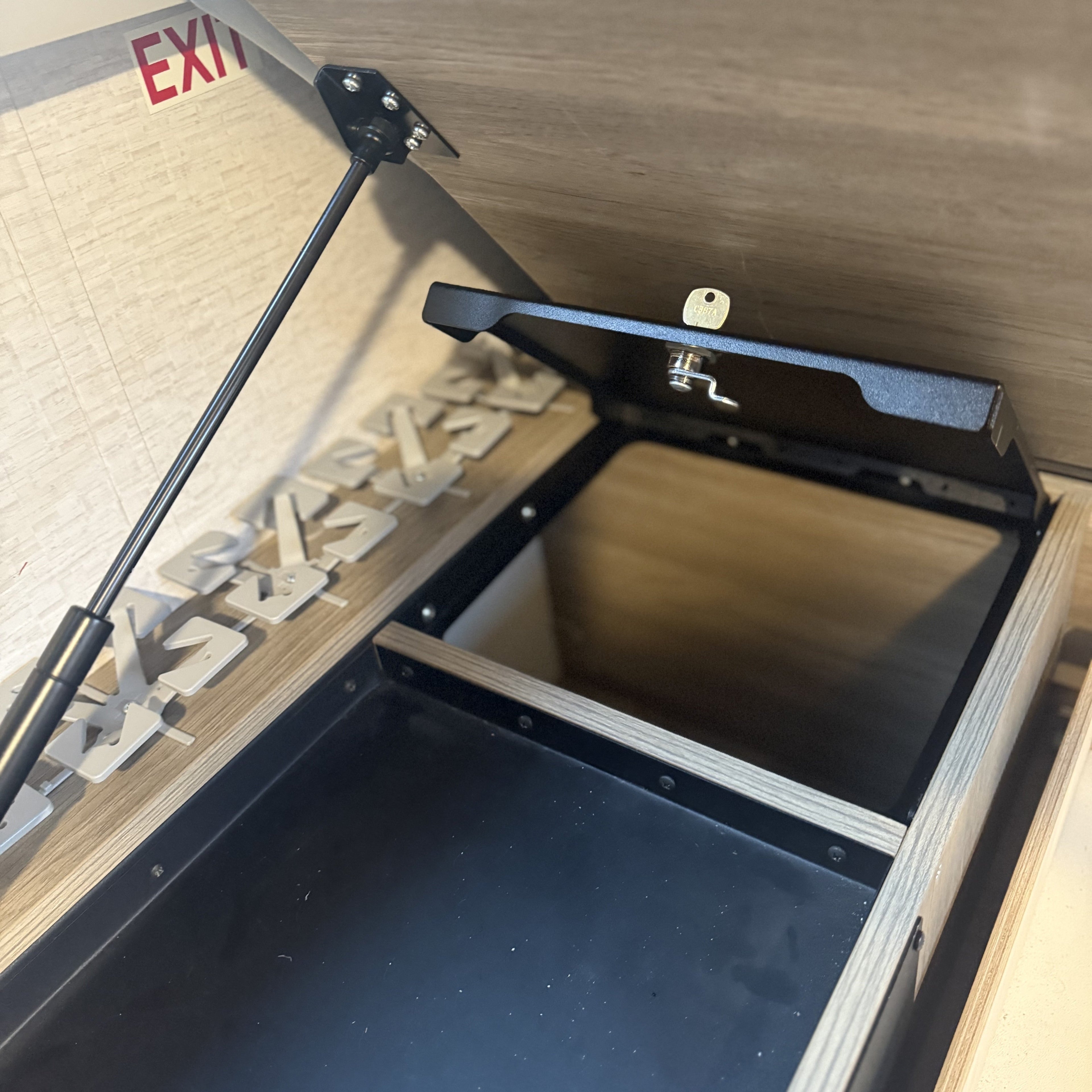 Open view of the Avatar Offroad Ekko Under Bed Locking Storage Door, fitted to an overland van build