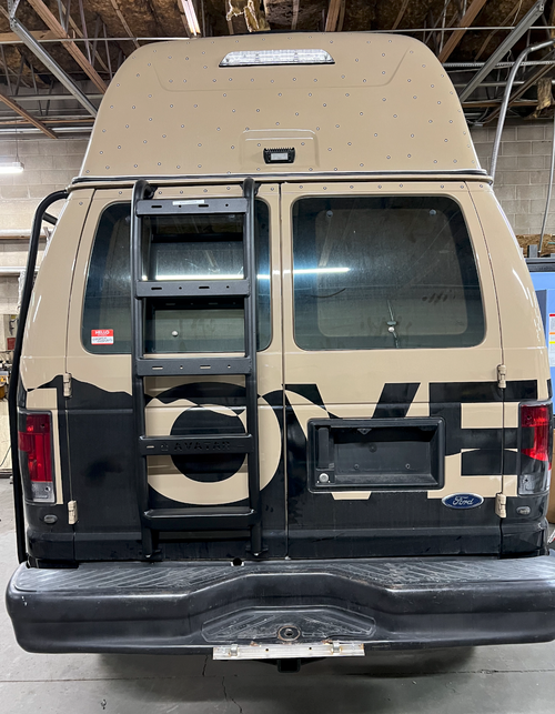 Avatar Offroad rear ladder for the Ford E-Series van mounted on the rear door in black powder coat