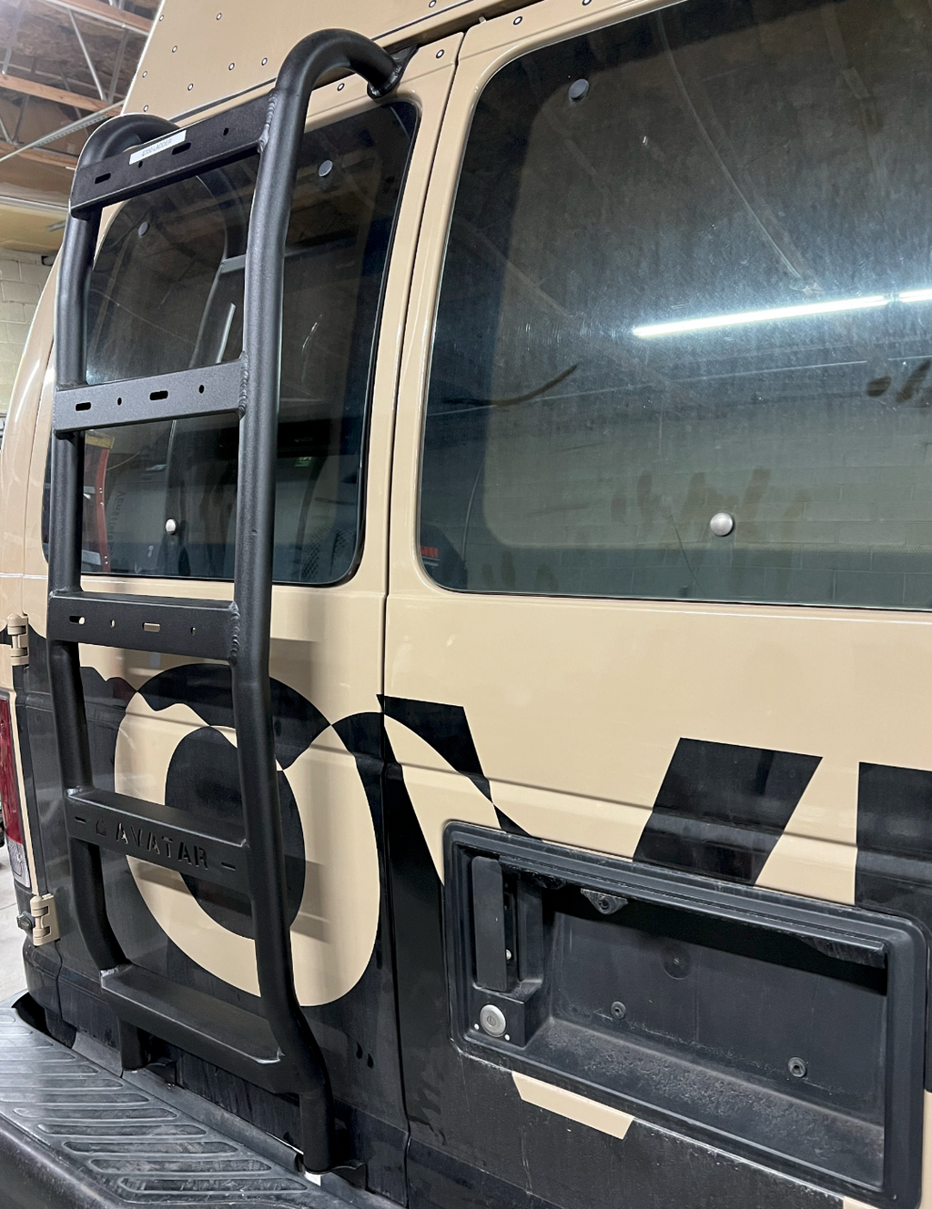Additional view of the Avatar Offroad Rear Ladder for Ford E-Series, fitted to an overland van build