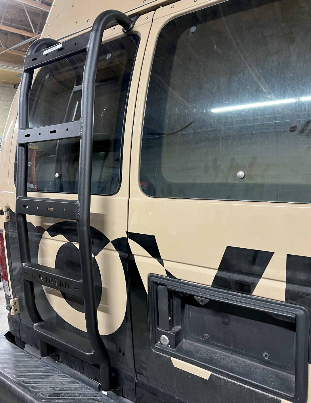 Additional view of the Avatar Offroad Rear Ladder for Ford E-Series, fitted to an overland van build