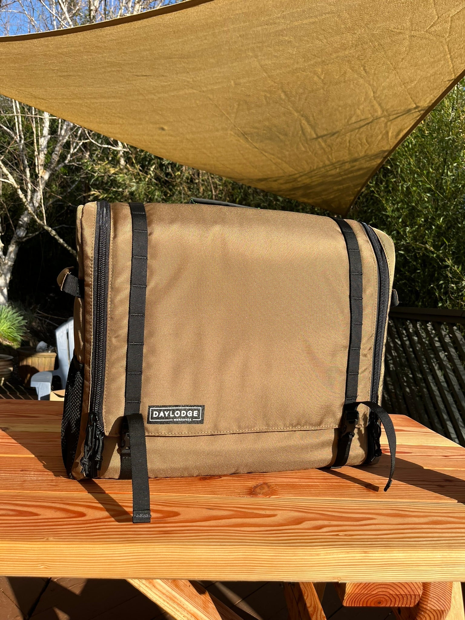 Close up of the DAYLODGE Workspace Field Bag, part of a vehicle based camp and travel setup