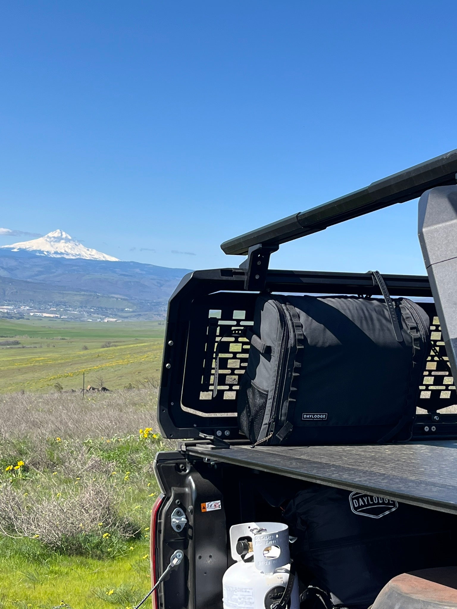 Another angle on the DAYLODGE Workspace Field Bag, part of a vehicle based camp and travel setup
