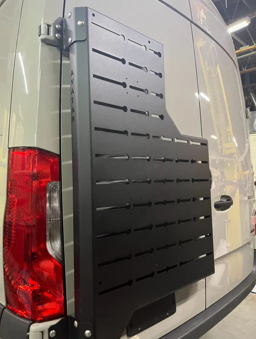 Angled view of the Avatar Offroad Outpost Sprinter Mounting Carrier, fitted to an overland van build