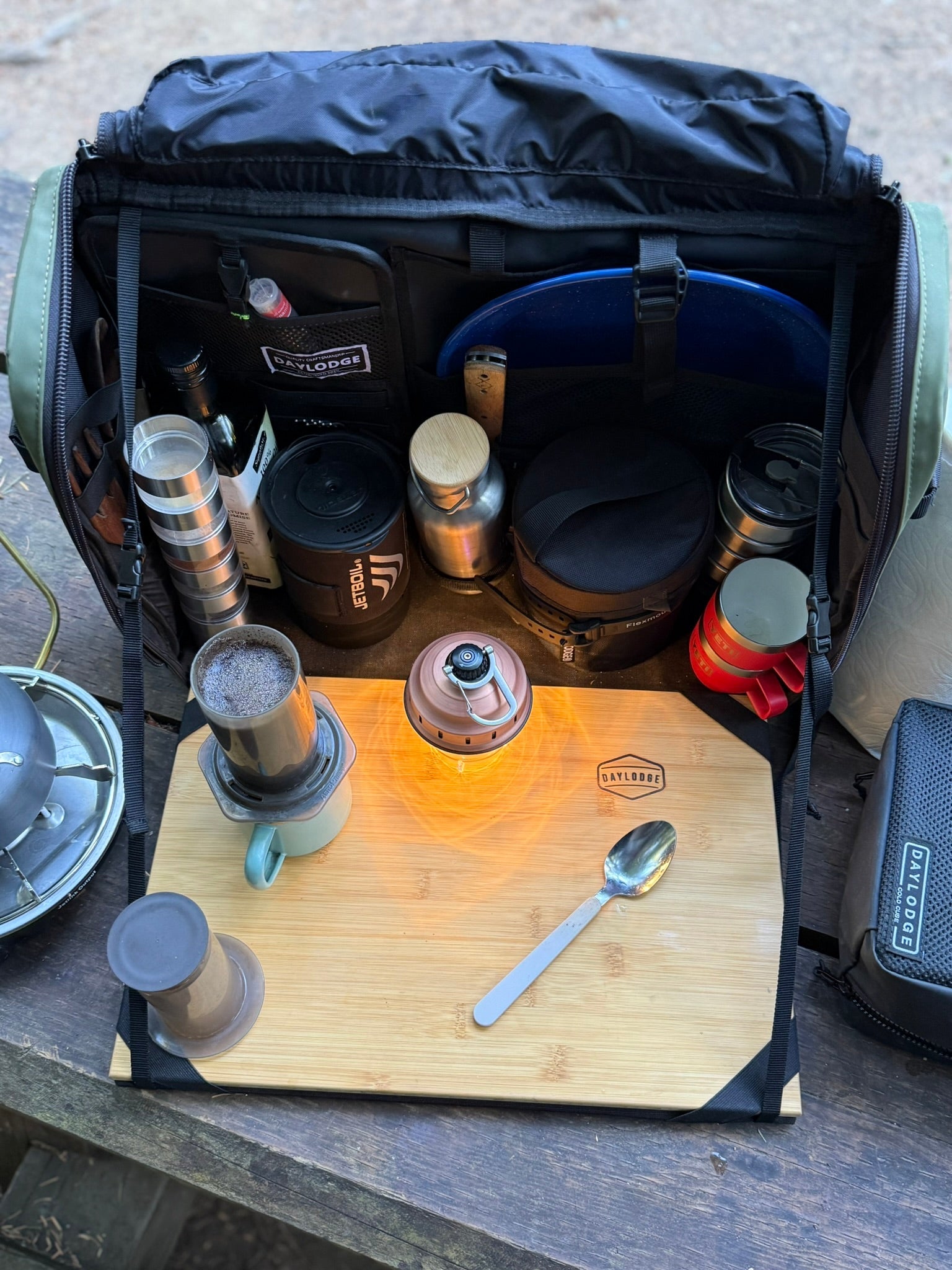 Wider view of the DAYLODGE Workspace Mobile Camp Kitchen, part of a vehicle based camp and travel setup