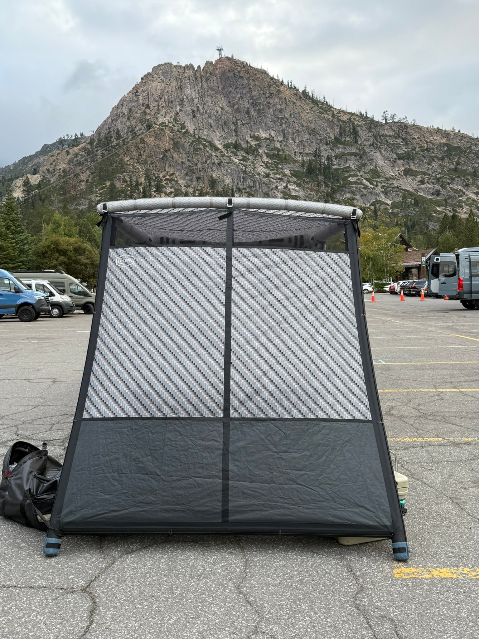 Studio view of the DAYLODGE AirHaven 40 Annex Wall Kit, part of a vehicle based camp and travel setup