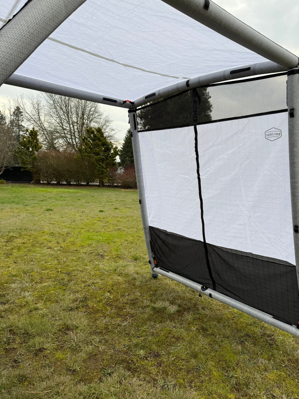 Another angle on the DAYLODGE AirHaven 40 Annex Wall Kit, part of a vehicle based camp and travel setup