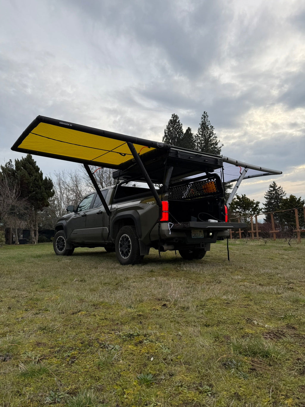 Close up of the DAYLODGE AirHaven 40 Vehicle Shelter System, part of a vehicle based camp and travel setup