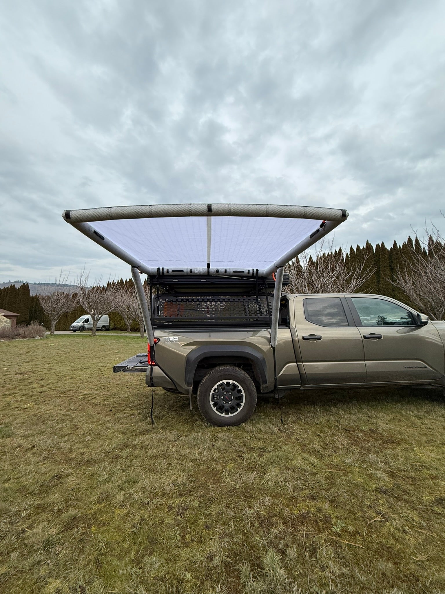 Further view of the DAYLODGE AirHaven 40 Vehicle Shelter System, part of a vehicle based camp and travel setup