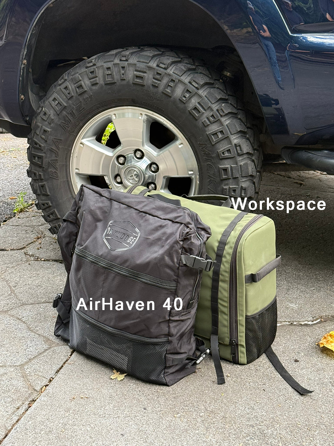 Lifestyle view of the DAYLODGE AirHaven 40 Vehicle Shelter System, part of a vehicle based camp and travel setup