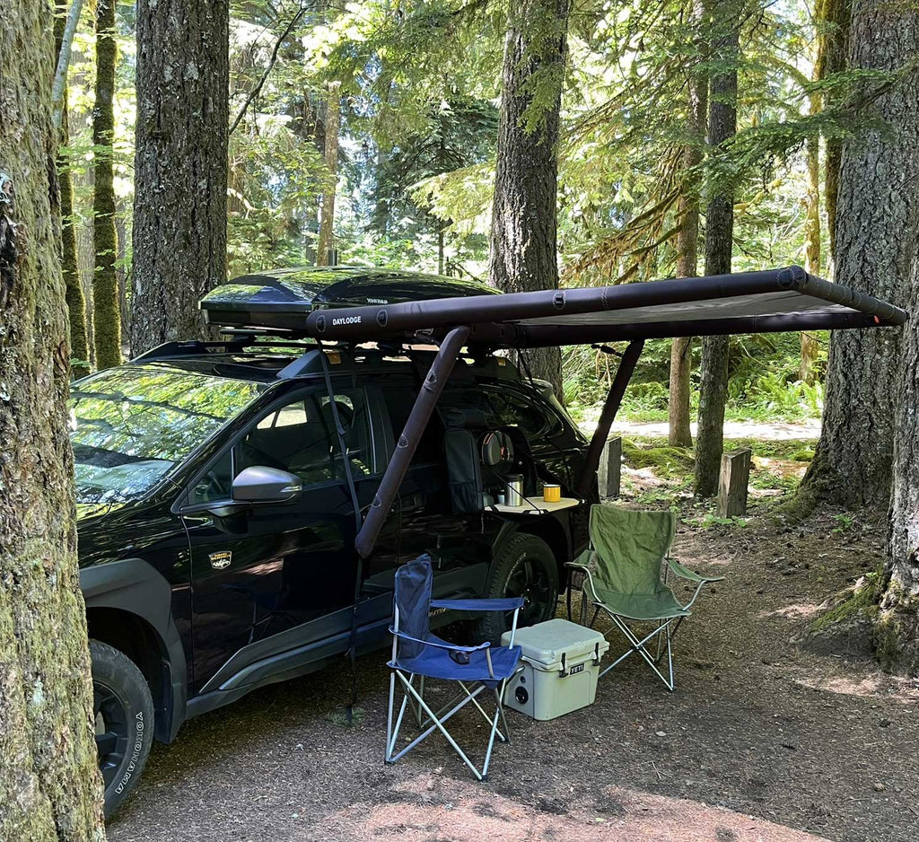 Context view of the DAYLODGE AirHaven 40 Vehicle Shelter System, part of a vehicle based camp and travel setup