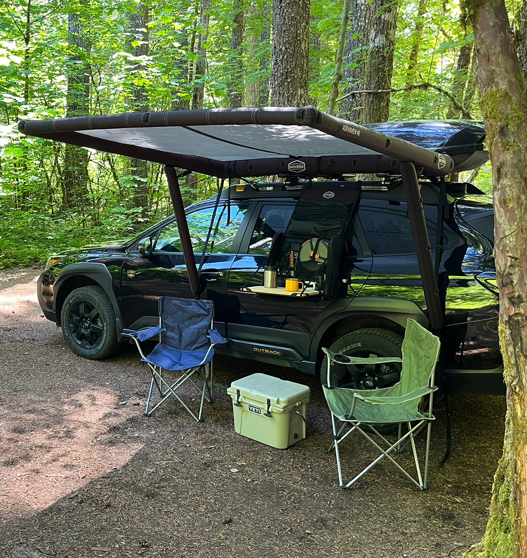 Studio view of the DAYLODGE AirHaven 40 Vehicle Shelter System, part of a vehicle based camp and travel setup