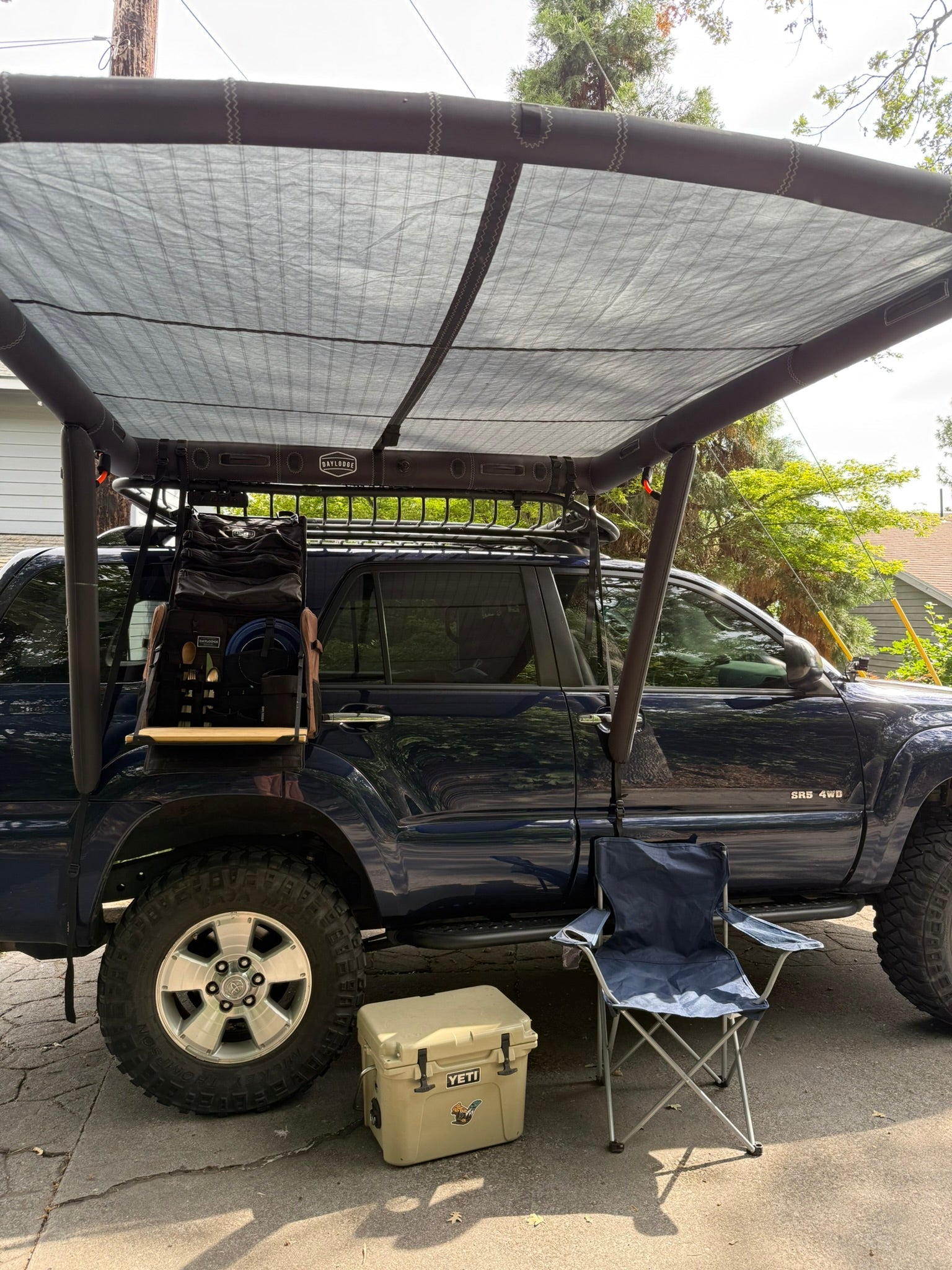 Extra view of the DAYLODGE AirHaven 40 Vehicle Shelter System, part of a vehicle based camp and travel setup
