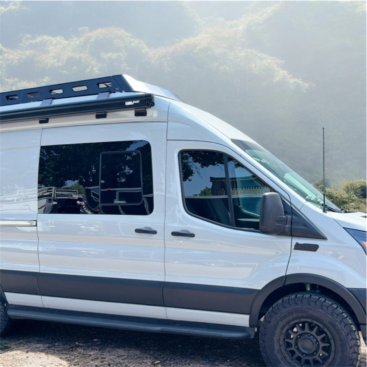 Close up of the Avatar Offroad Rockbody Side Steps for Ford Transit, fitted to an overland van build