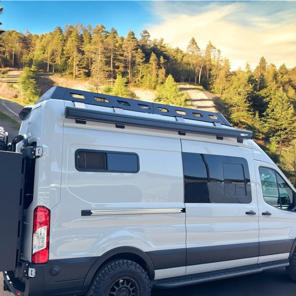 Angled view of the Avatar Offroad Rockbody Side Steps for Ford Transit, fitted to an overland van build