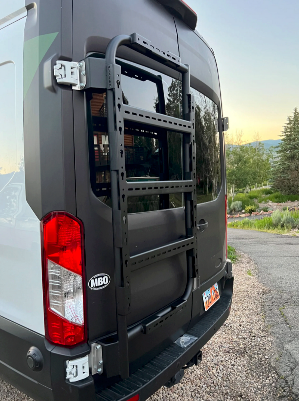 In use view of the Avatar Offroad Massif Van Rear Door Storage System, fitted to an overland van build