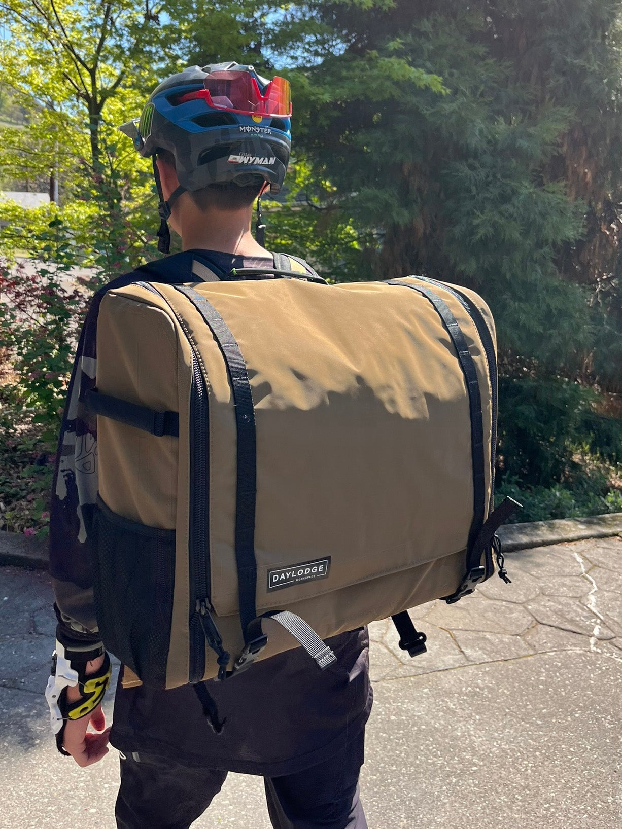 Rear view of the DAYLODGE Workspace Backpack Straps, part of a vehicle based camp and travel setup