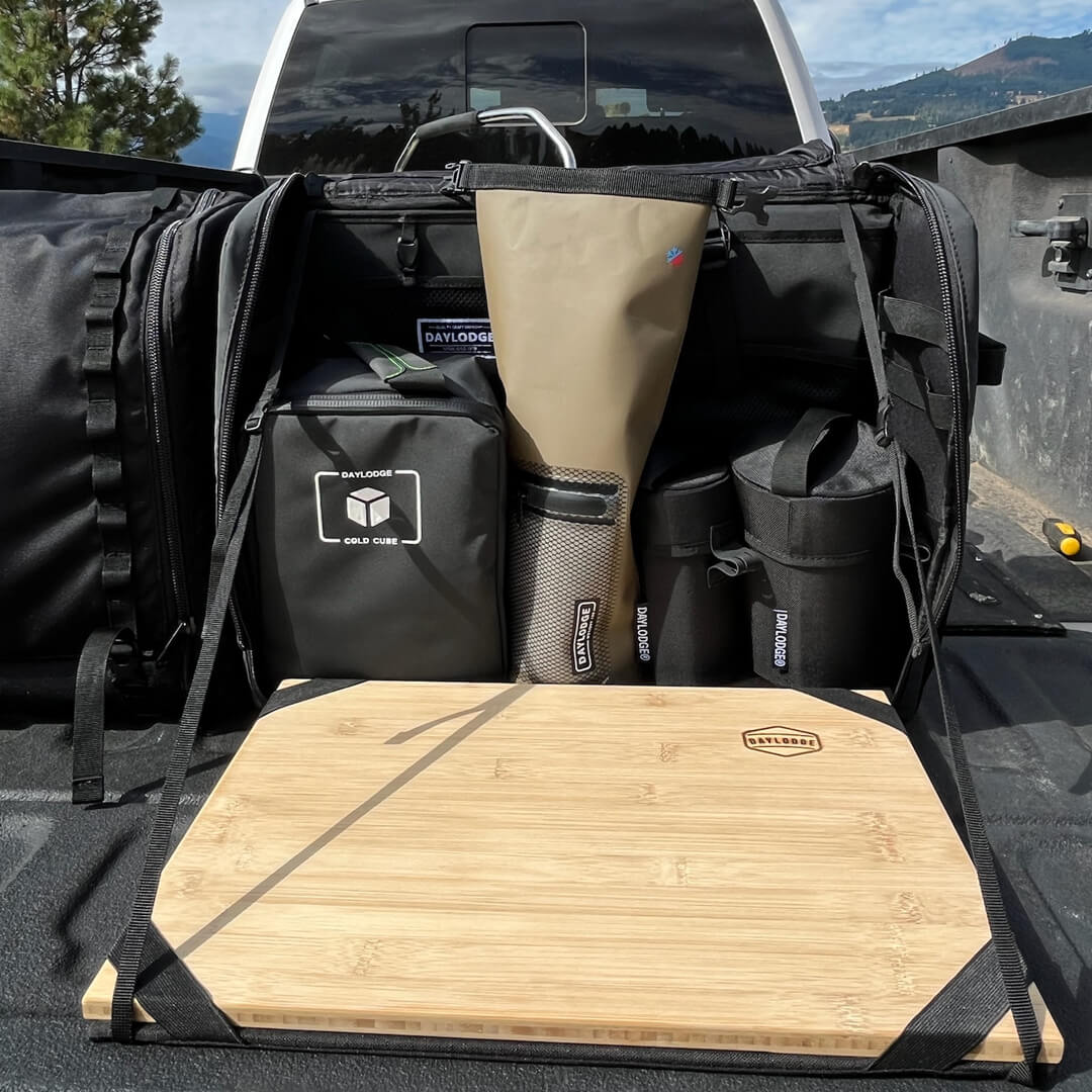 DAYLODGE Workspace camp collection kitchen set laid out on a vehicle tailgate ready for cooking
