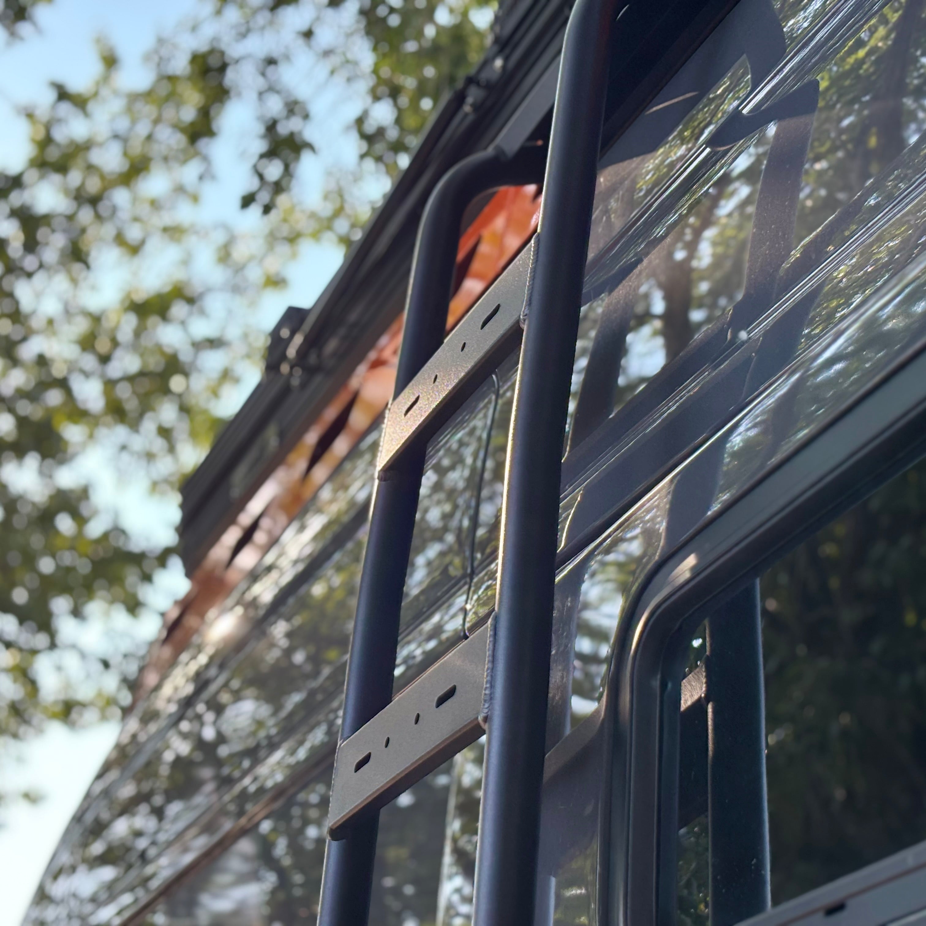 Wider view of the Avatar Offroad Side Ladder for Mercedes Sprinter, part of the Avatar Offroad van storage and overland range