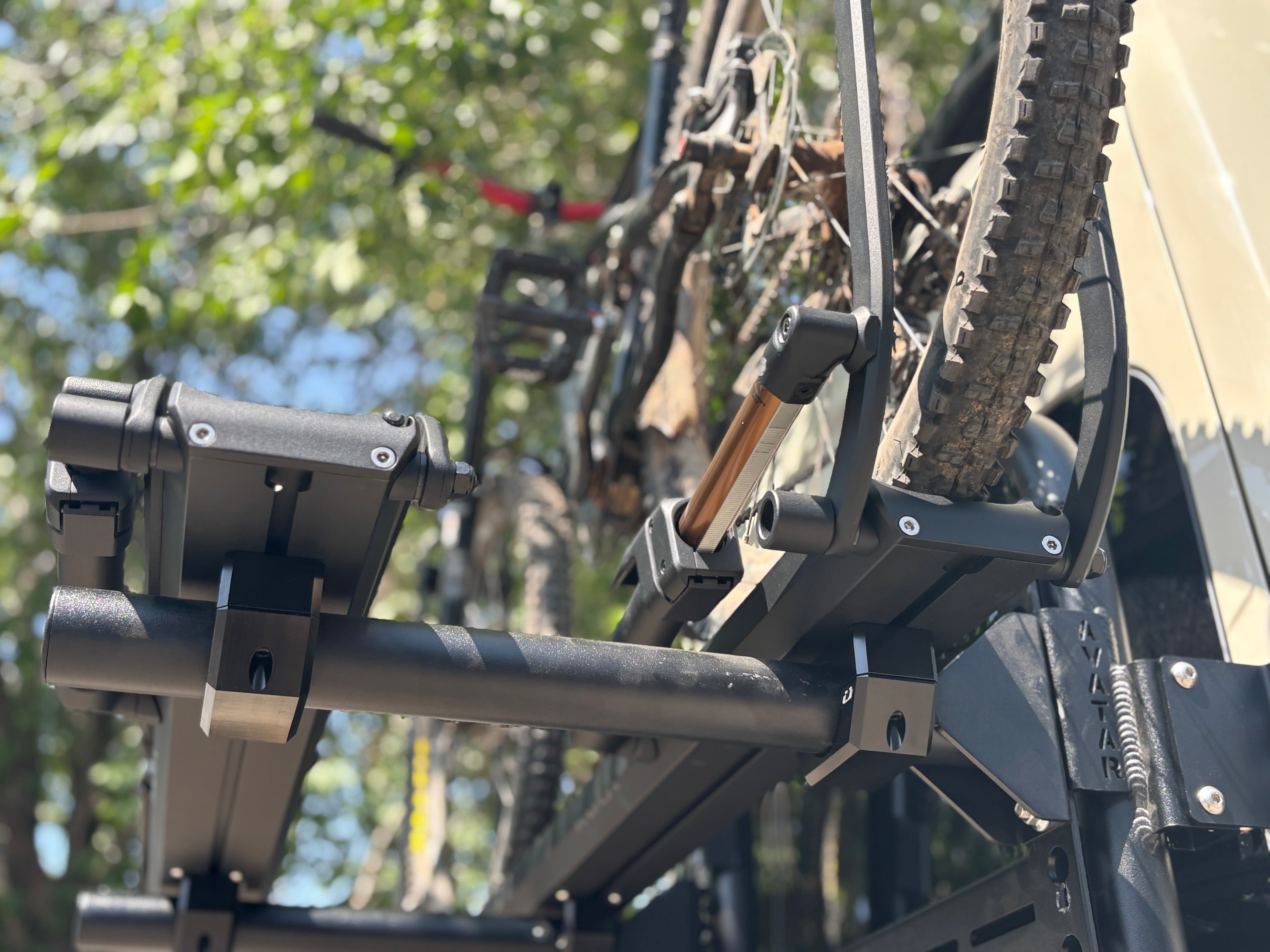 Angled view of the Avatar Offroad Bike Posts for the Massif System, part of the Avatar Offroad van storage and overland range