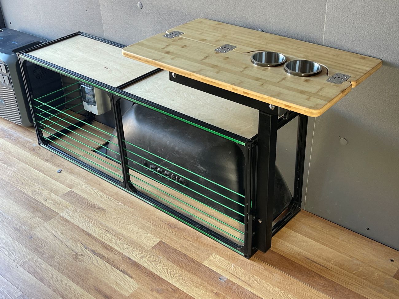 Studio view of the TNTvans Wheel Well Bench with Storage for Camper Vans, part of a DIY camper van conversion interior
