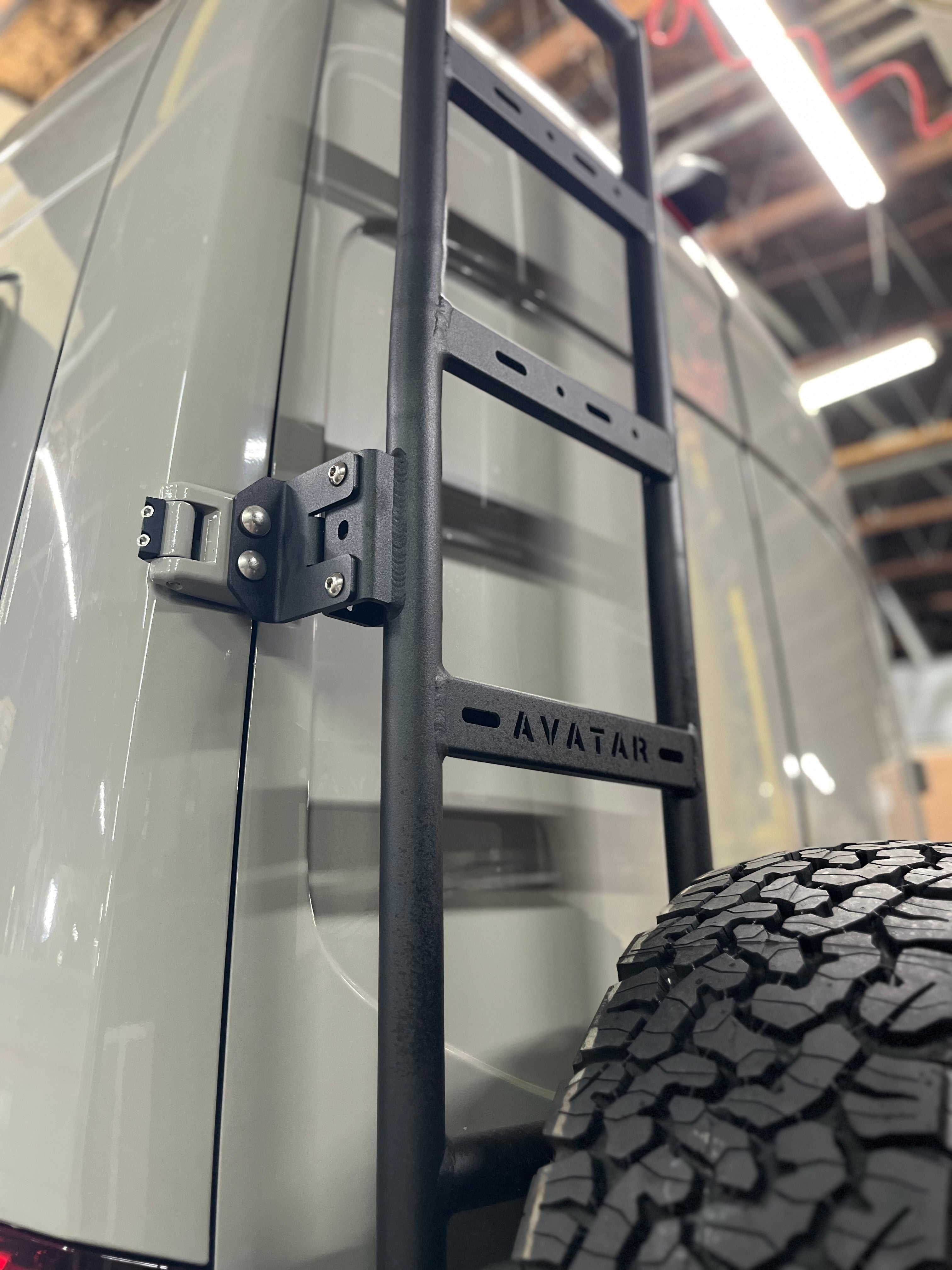Further view of the Avatar Offroad Rear Ladder with Tire Carrier for Vans, fitted to an overland van build