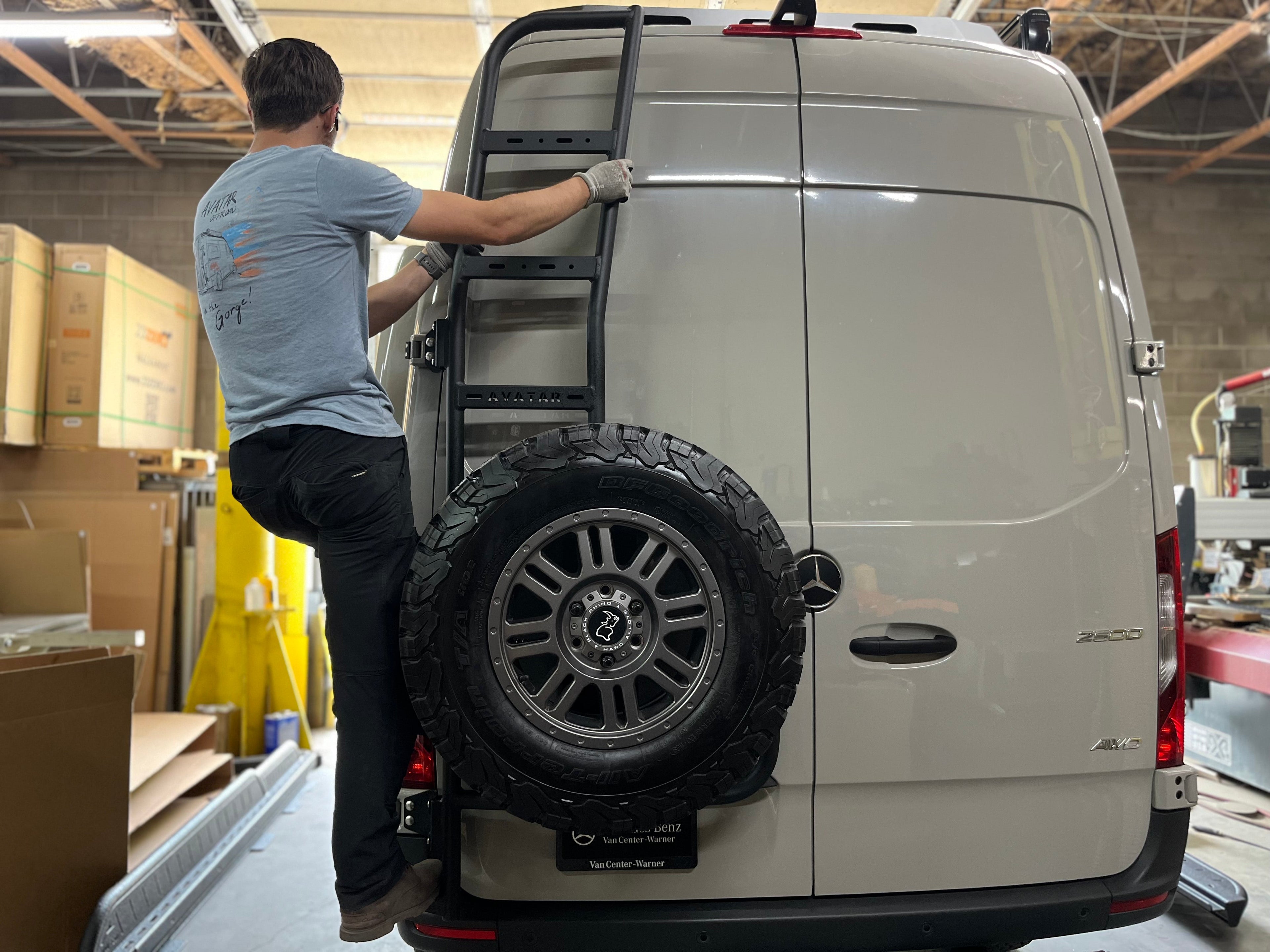 Alternate view of the Avatar Offroad Rear Ladder with Tire Carrier for Vans, fitted to an overland van build