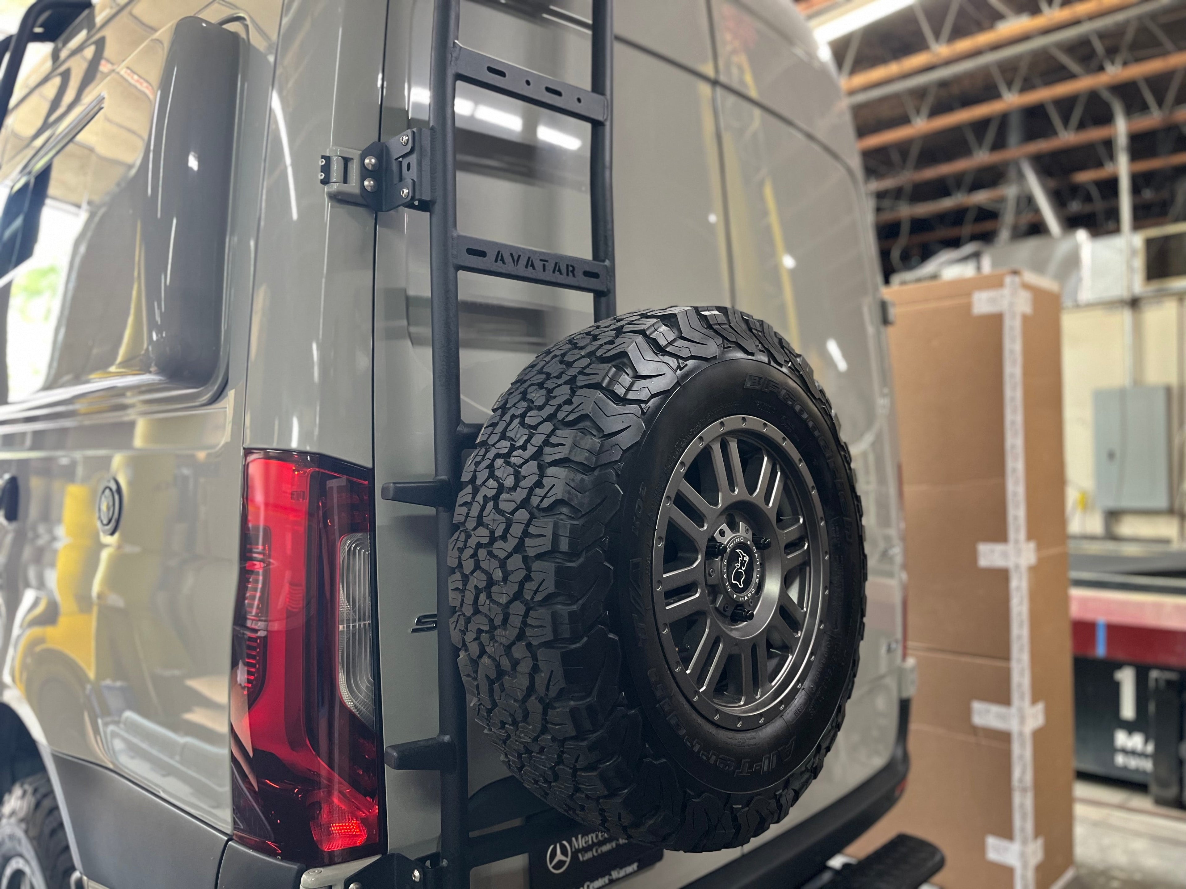 Additional view of the Avatar Offroad Rear Ladder with Tire Carrier for Vans, fitted to an overland van build