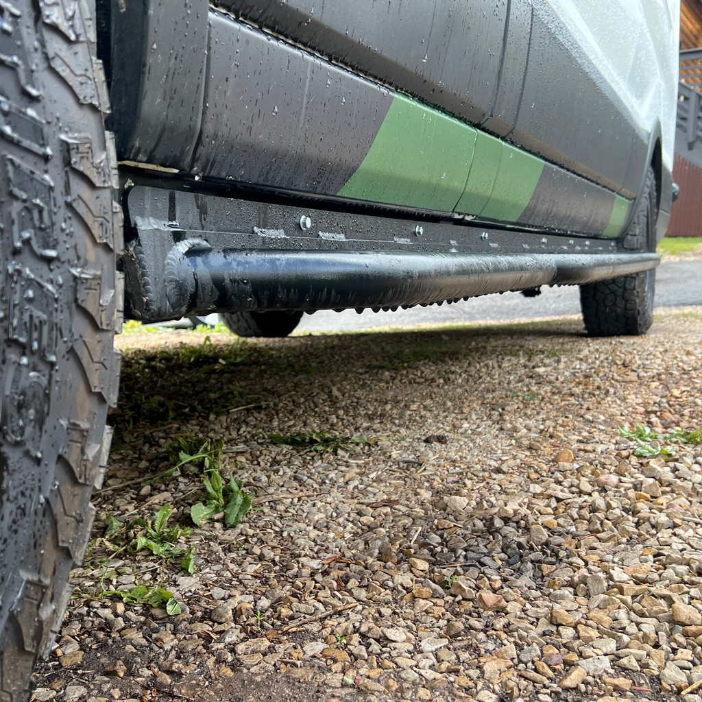 Wider view of the Avatar Offroad Rockbody Side Steps for Ford Transit, fitted to an overland van build