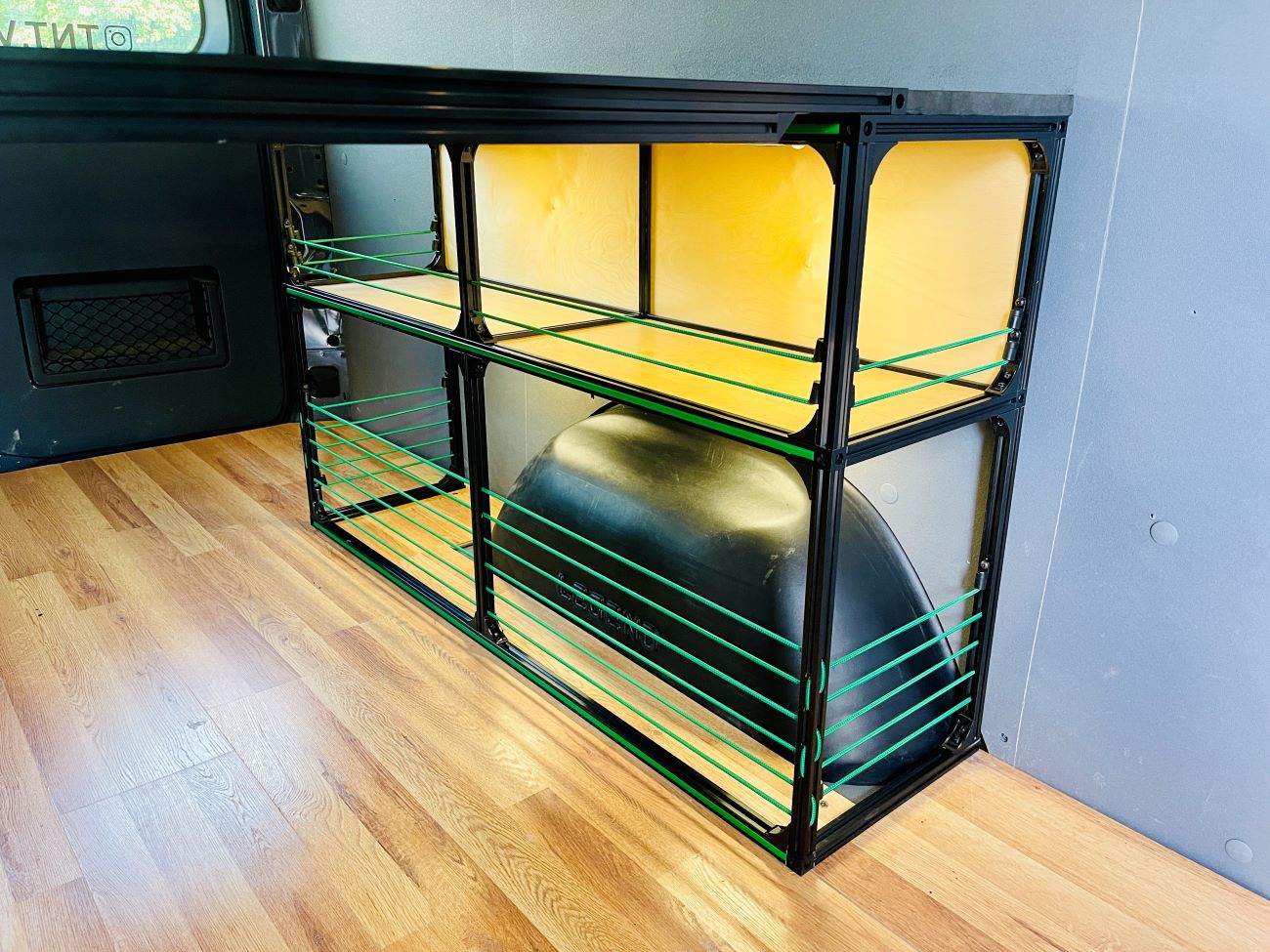 Alternate view of the TNTvans 48 Inch Van Bed and Shelving Kit, part of a DIY camper van conversion interior