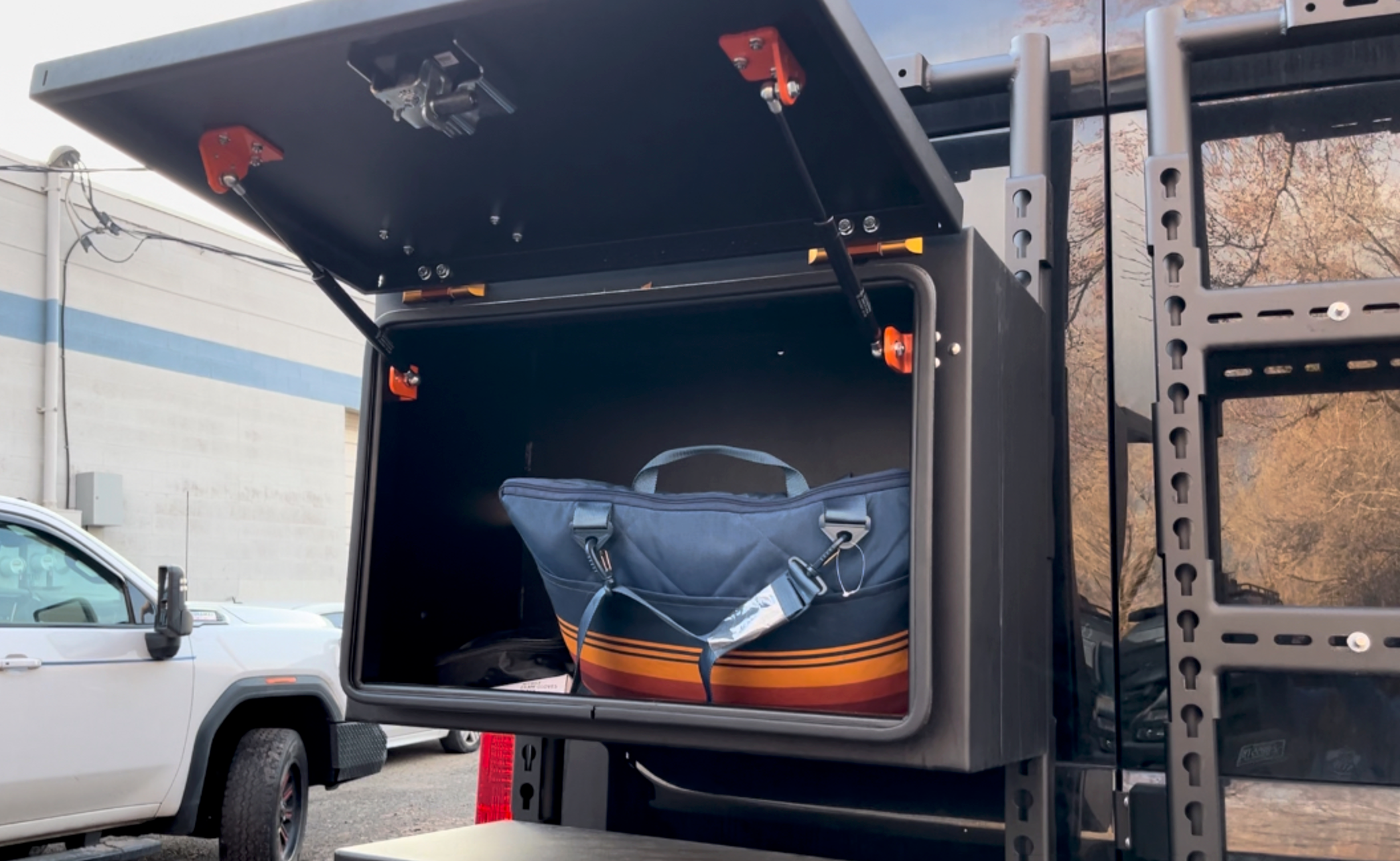 Further view of the Avatar Offroad Deka Small Rear Door Storage Box, fitted to an overland van build