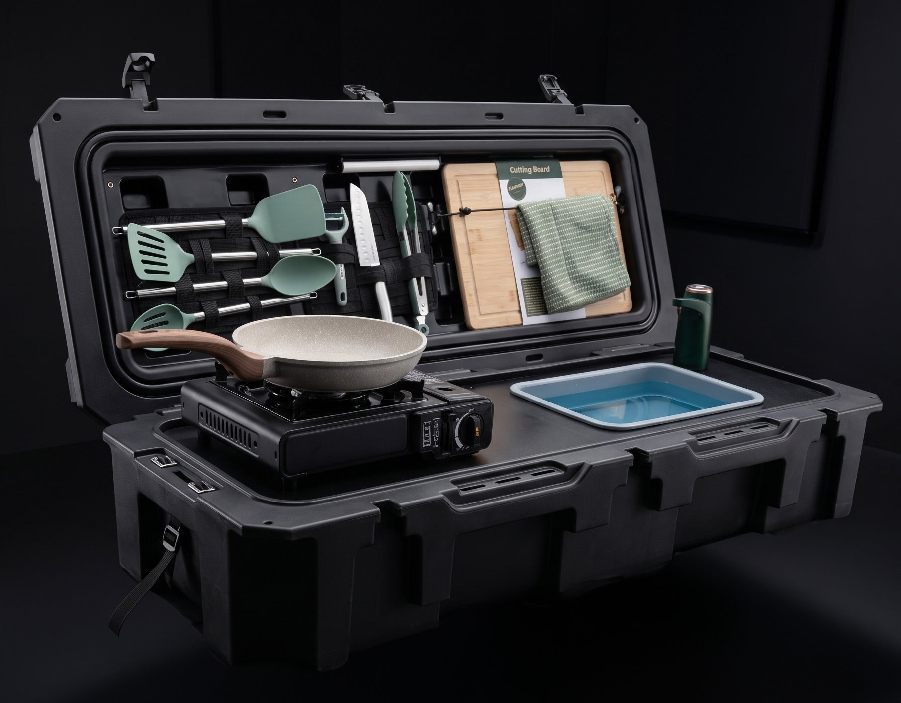 VOZ Camp Kitchen portable cook station shown as a closed black case ready for camp cooking
