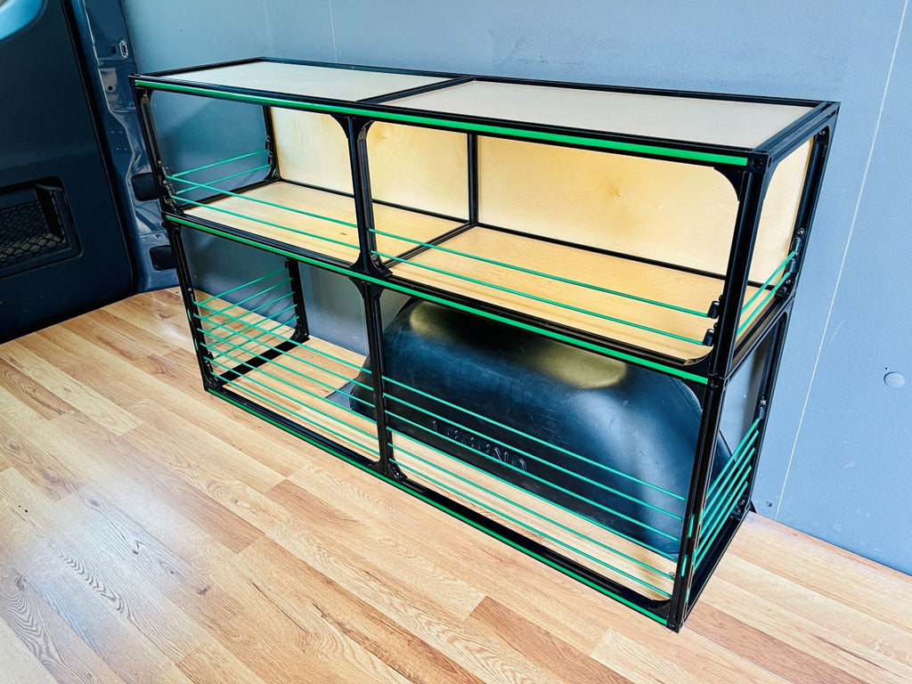 Wider view of the TNTvans Wheel Well Shelving Kit for Camper Vans, part of a DIY camper van conversion interior